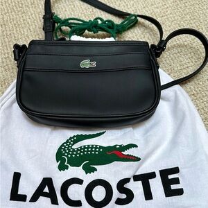 Never used…Lacoste original cross body/shoulder bag in matte black